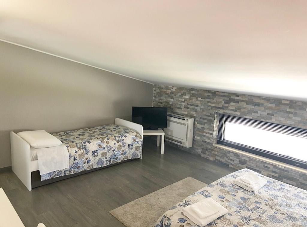Postel nebo postele na pokoji v ubytování Pietra Bianca Rooms