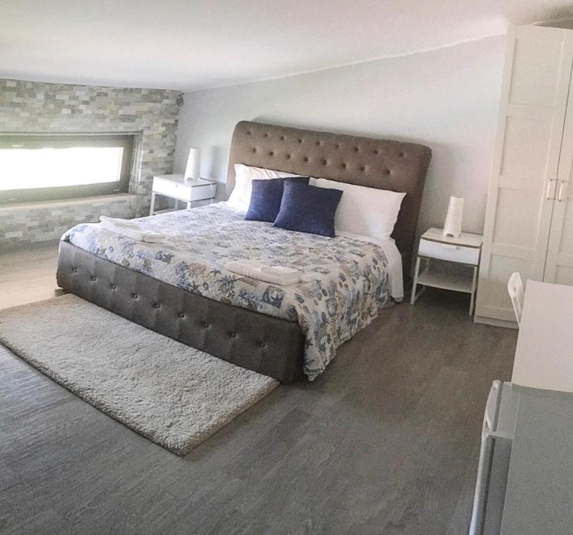 Postel nebo postele na pokoji v ubytování Pietra Bianca Rooms