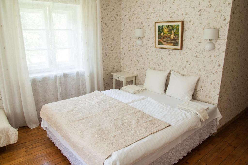 Postel nebo postele na pokoji v ubytování Viesu māja Sprīdīši