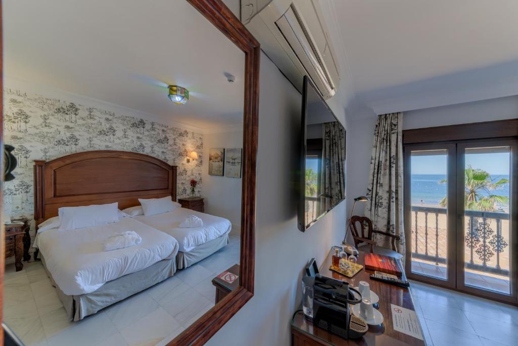 Vuode tai vuoteita majoituspaikassa Hotel Playa de Regla