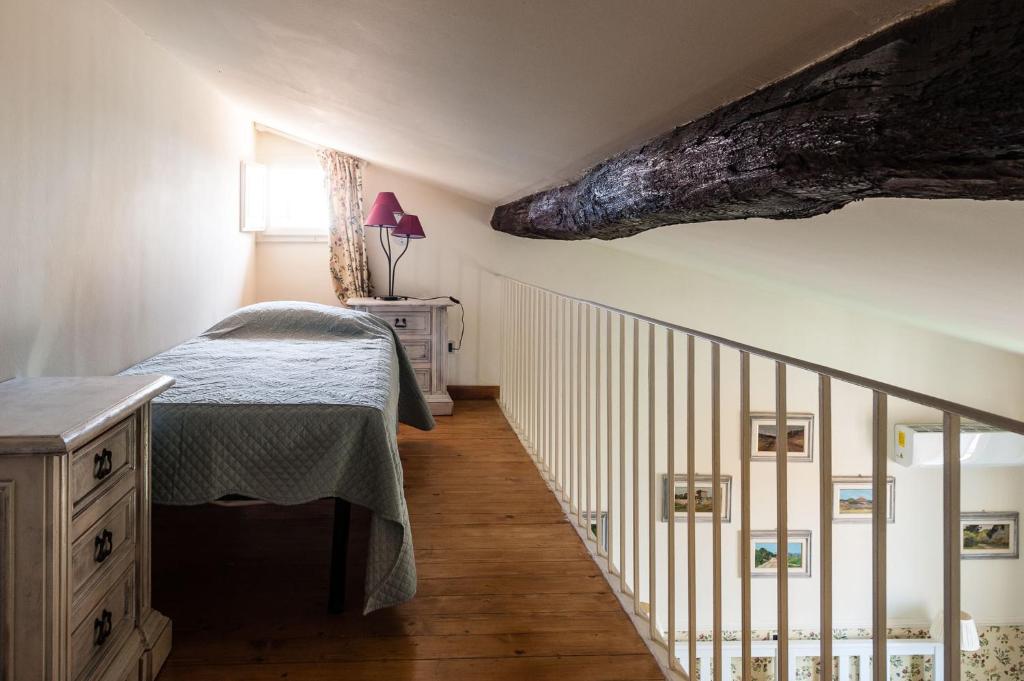 Postel nebo postele na pokoji v ubytování B&B Attico sulla Torre