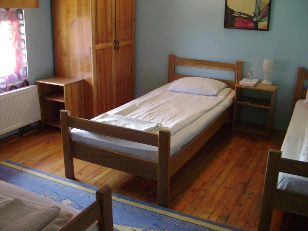 Postel nebo postele na pokoji v ubytování Pensiunea Popasul Iancului