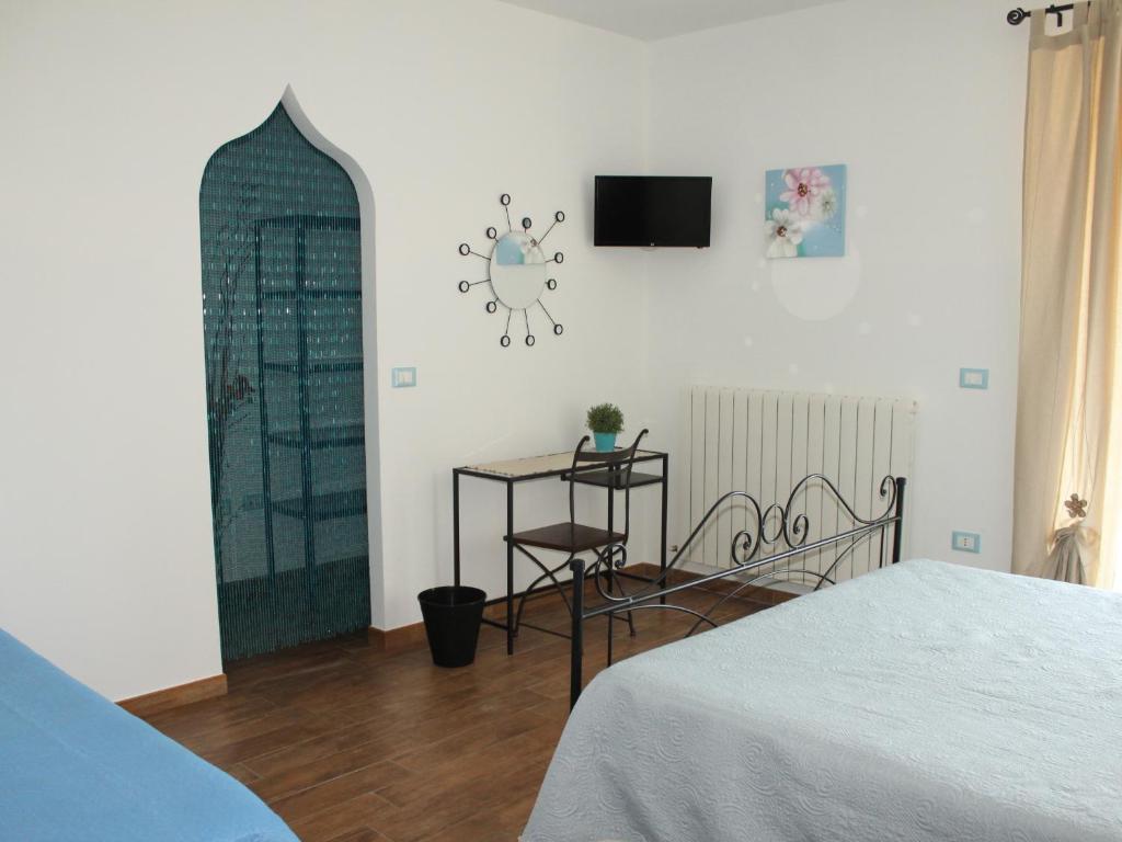 Łóżko lub łóżka w pokoju w obiekcie B&B La poeta