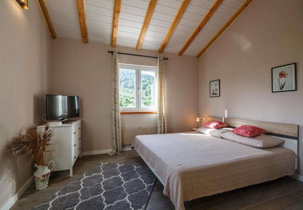 Postel nebo postele na pokoji v ubytování Apartments Mardešić