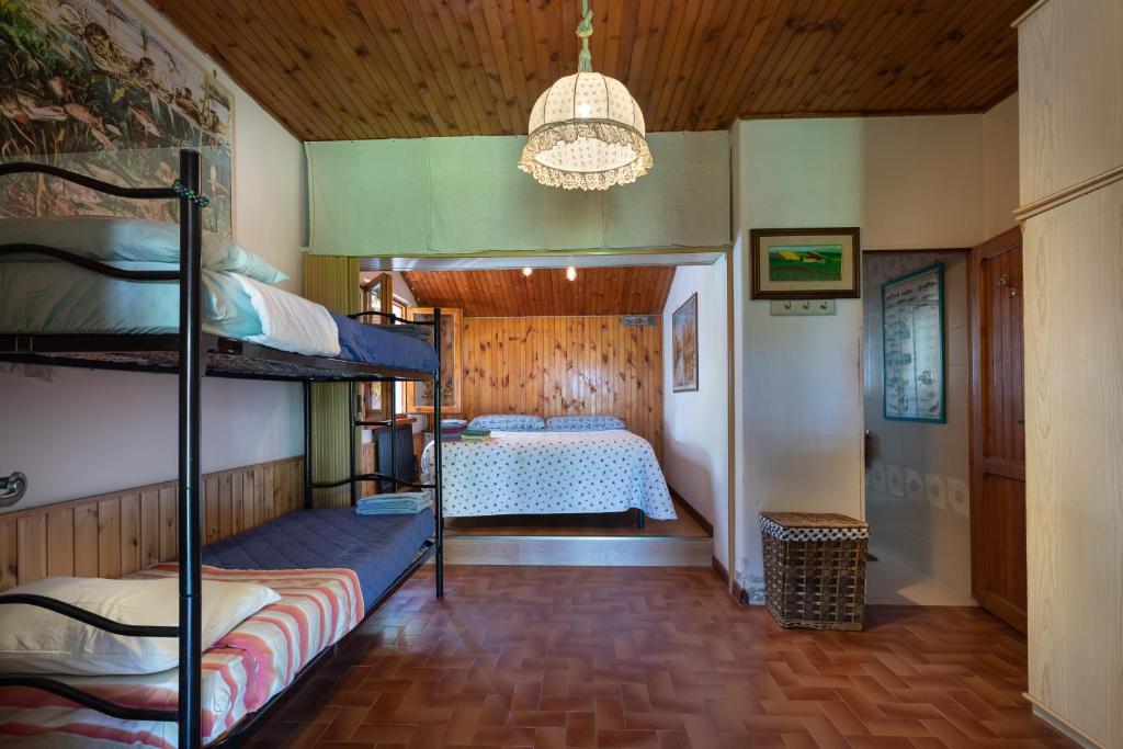 Postel nebo postele na pokoji v ubytování Chalet sul Trasimeno
