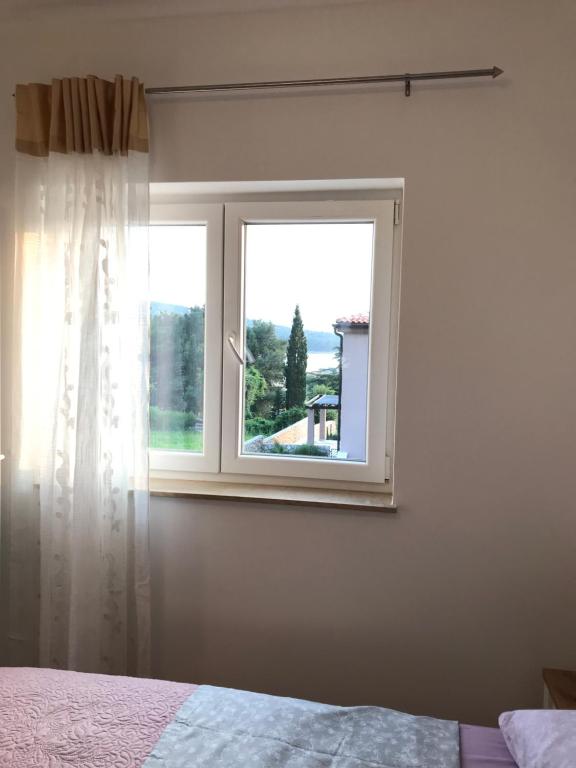 Posteľ alebo postele v izbe v ubytovaní Apartmani Matea