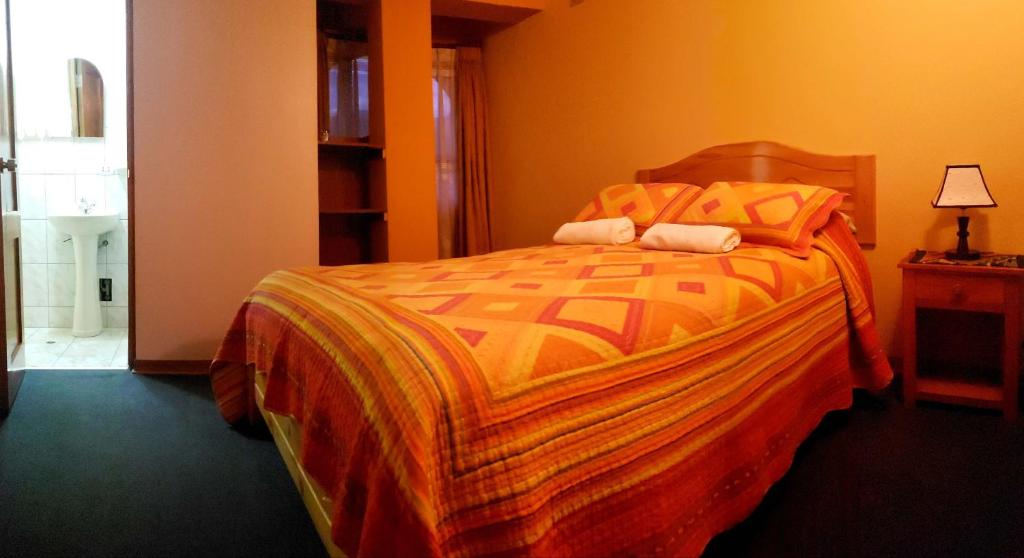 Postel nebo postele na pokoji v ubytování Morales Guest House