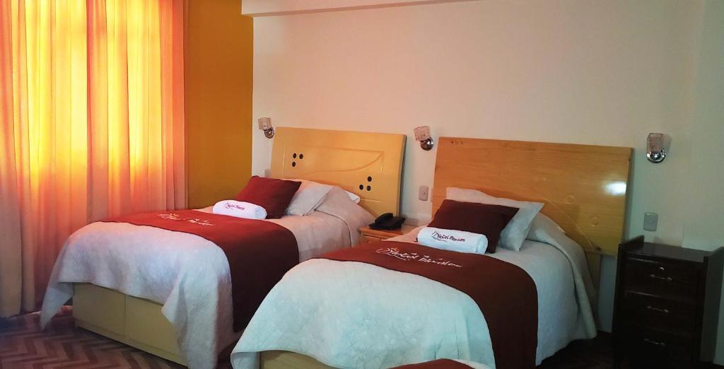 Postel nebo postele na pokoji v ubytování Morales Guest House
