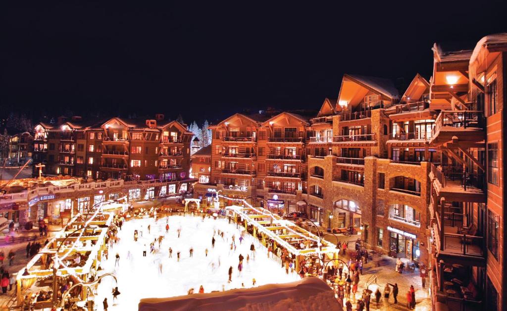 a large building with a lot of windows and a lot of people at Northstar California Resort in Truckee