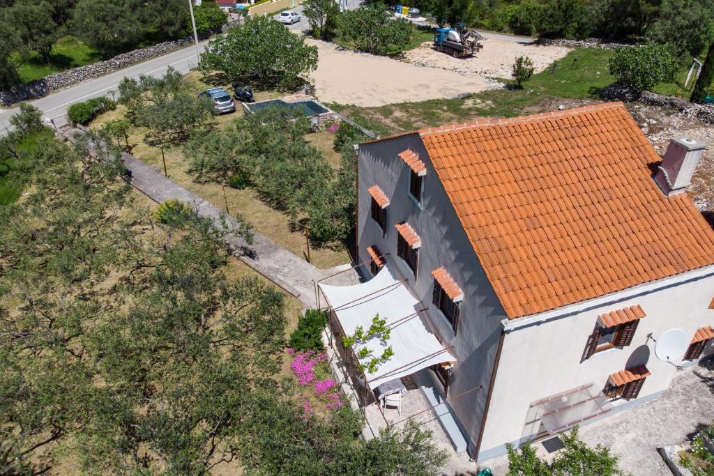 an overhead view of a house with an orange roof at CASA OLIVA in Sveti Jakov