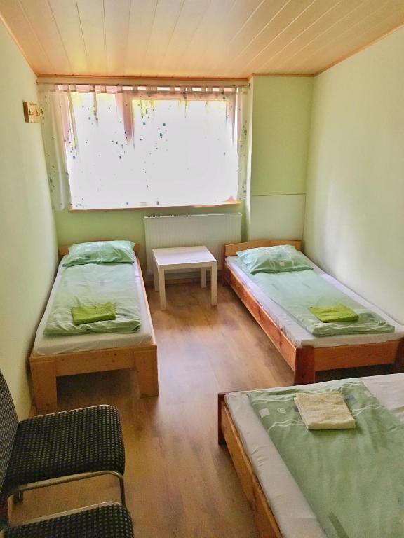 Postel nebo postele na pokoji v ubytování Rezydencja pod Gwiazdami
