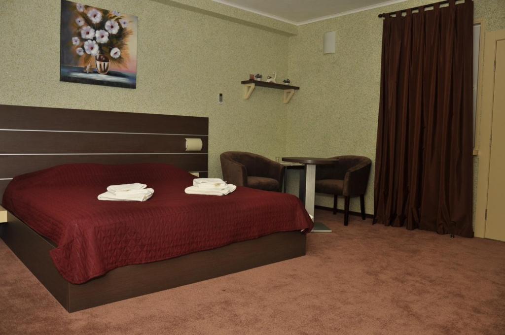 Postel nebo postele na pokoji v ubytování motel-Yasniy