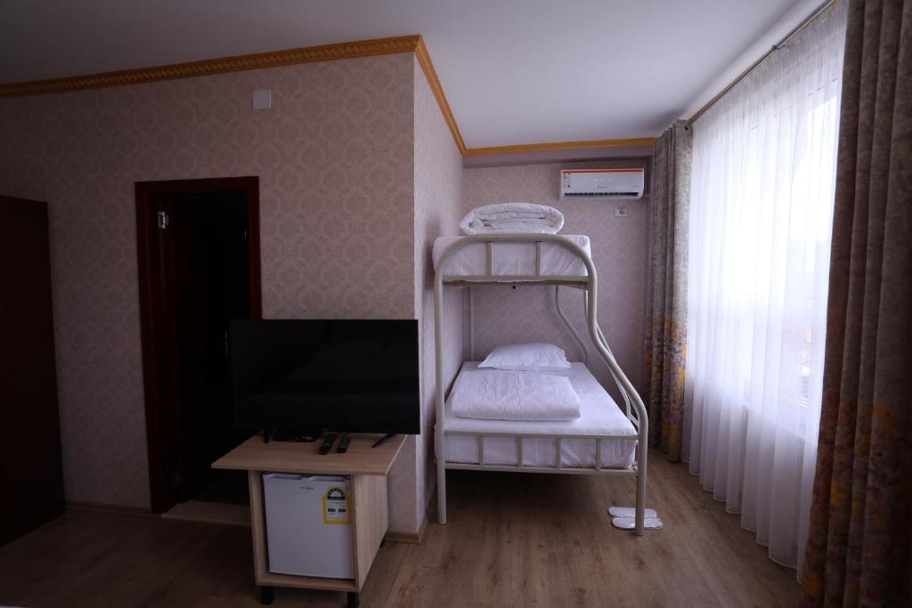 Postel nebo postele na pokoji v ubytování British Hotel Pogradec