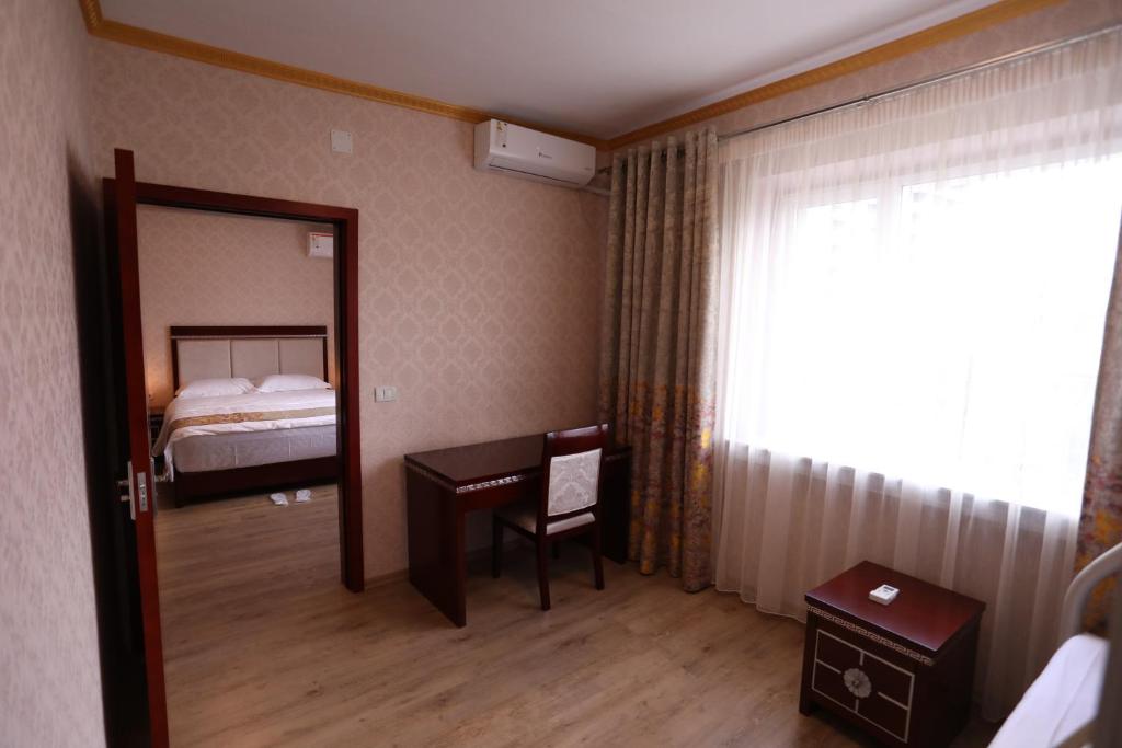 Postel nebo postele na pokoji v ubytování British Hotel Pogradec
