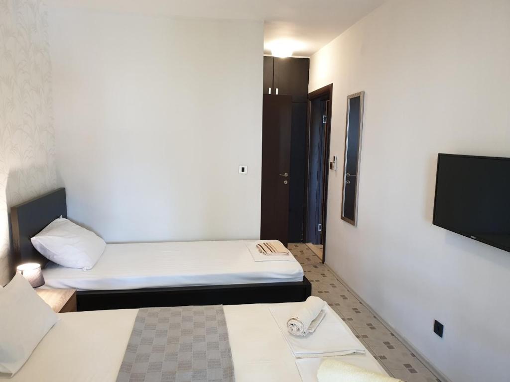 Voodi või voodid majutusasutuse Apartmani i sobe Goca toas