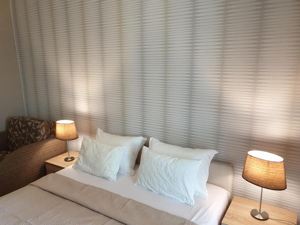 Voodi või voodid majutusasutuse Apartmani i sobe Goca toas