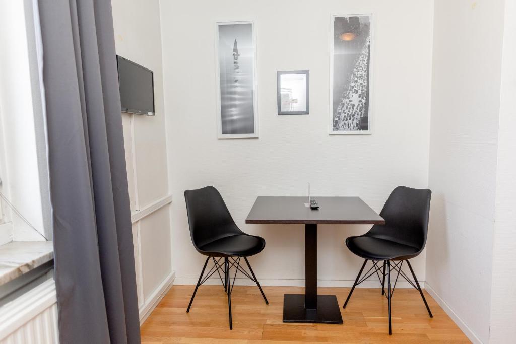 TV a/nebo společenská místnost v ubytování CarlstadCity H Boutique Hotell