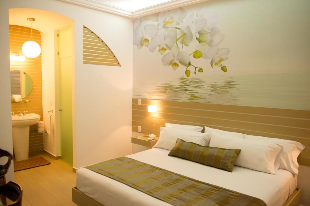 Postel nebo postele na pokoji v ubytování Grand Hotel Tepatitlán