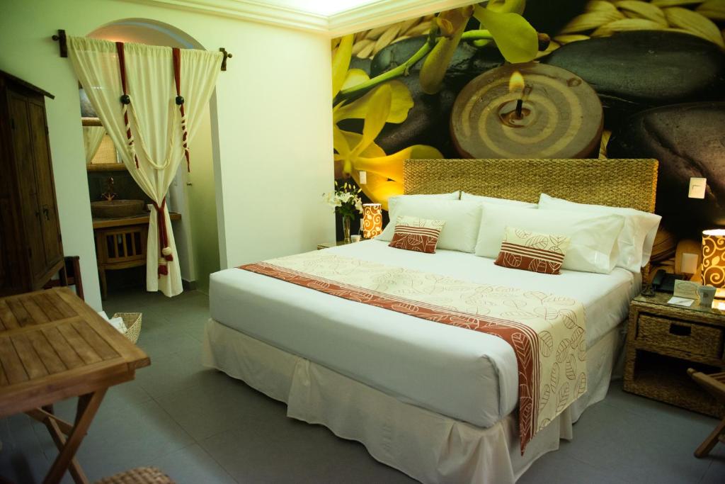Postel nebo postele na pokoji v ubytování Grand Hotel Tepatitlán