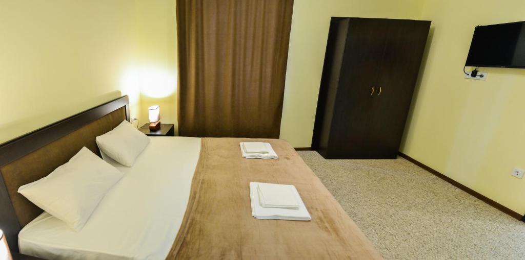 Postel nebo postele na pokoji v ubytování Hotel Garden