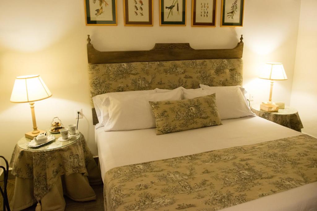 Postel nebo postele na pokoji v ubytování Grand Hotel Tepatitlán