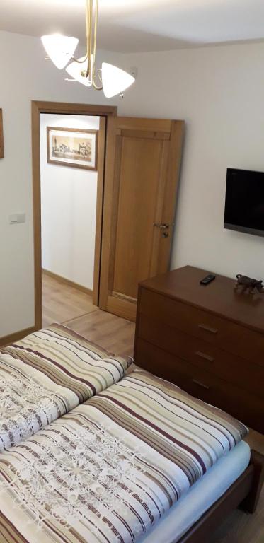 Posteľ alebo postele v izbe v ubytovaní Apartament u Janka