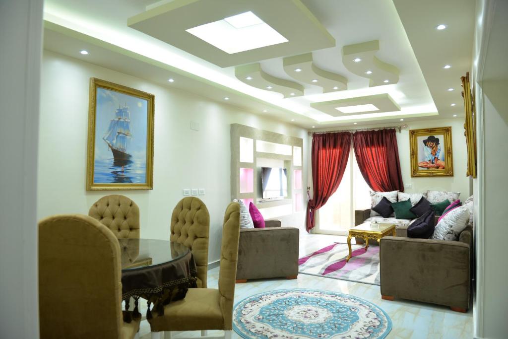 a living room with a table and a couch at City Square Bay View in Alexandria