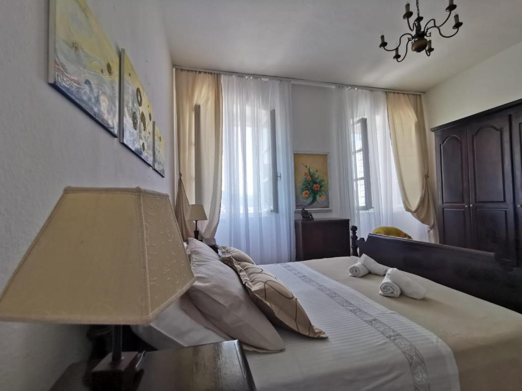 Postel nebo postele na pokoji v ubytování Apartman nono Ive