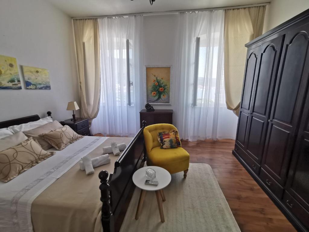 Postel nebo postele na pokoji v ubytování Apartman nono Ive