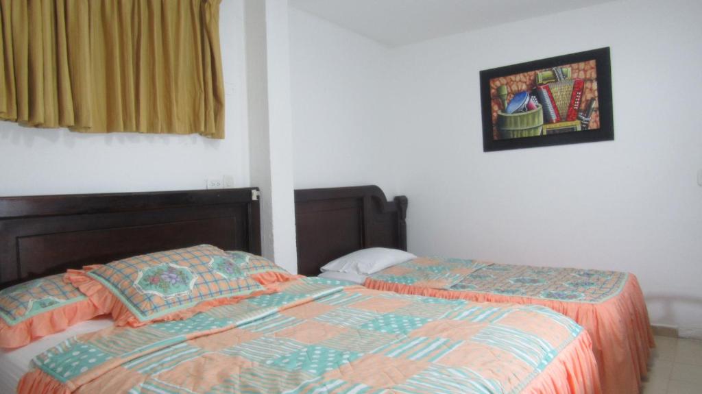 Postel nebo postele na pokoji v ubytování Hotel Nuevo Tio