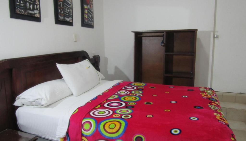 Postel nebo postele na pokoji v ubytování Hotel Nuevo Tio