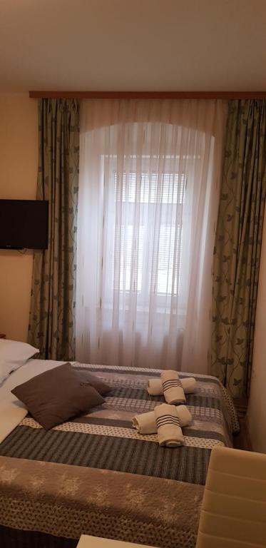 Postel nebo postele na pokoji v ubytování ELG Rooms