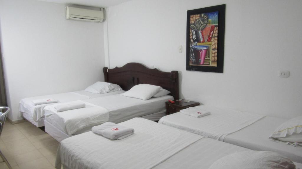 Postel nebo postele na pokoji v ubytování Hotel Nuevo Tio