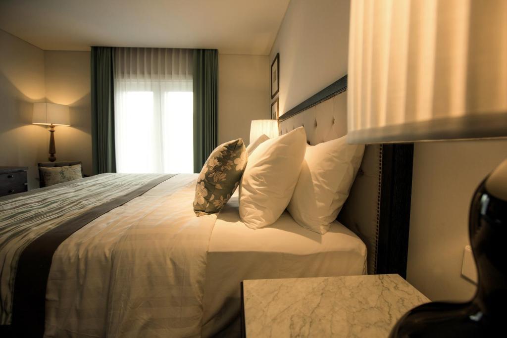 Postel nebo postele na pokoji v ubytování The Shalimar Boutique Hotel