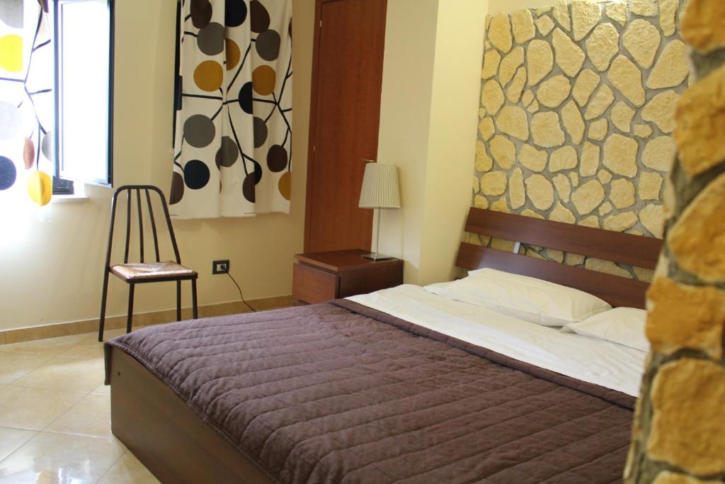 Postel nebo postele na pokoji v ubytování Hotel 106