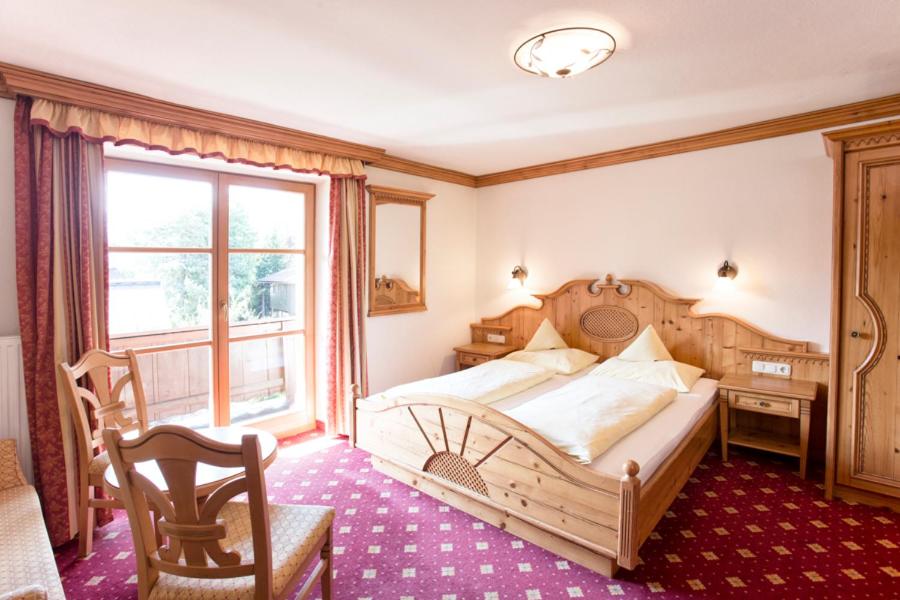 Postel nebo postele na pokoji v ubytování Pension Schmidinger