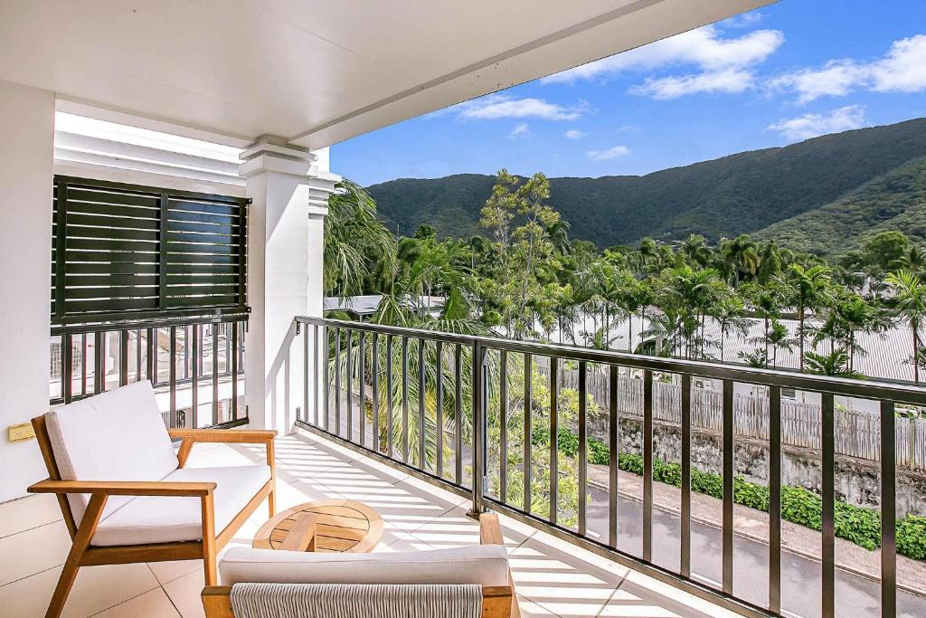 a balcony with a view of the mountains at Elysium Apartments in Palm Cove