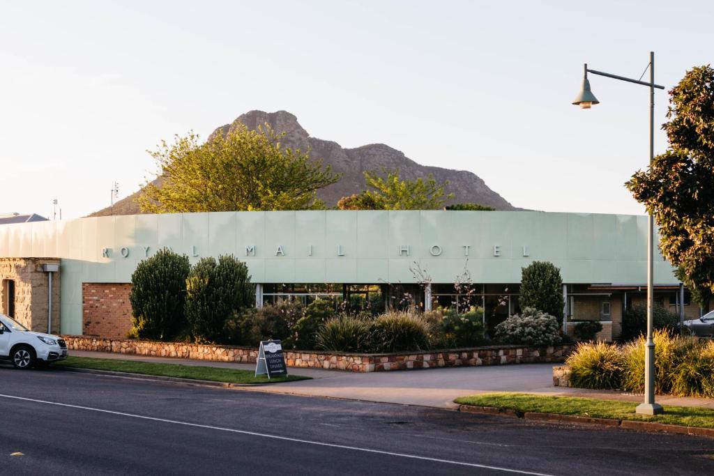 a white car parked in front of a building at Royal Mail Hotel in Dunkeld