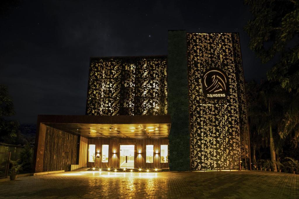 a building with lights on it at night at juSTa Rangers Munnar in Munnar