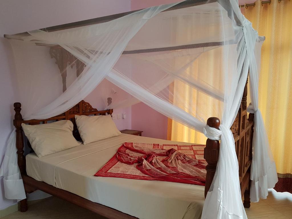 Postel nebo postele na pokoji v ubytování Daeli Apartment