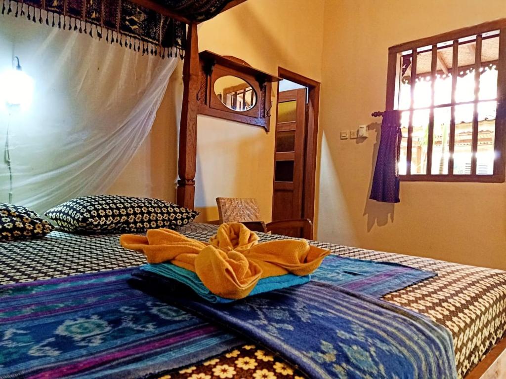 Postel nebo postele na pokoji v ubytování Bedhot Homestay
