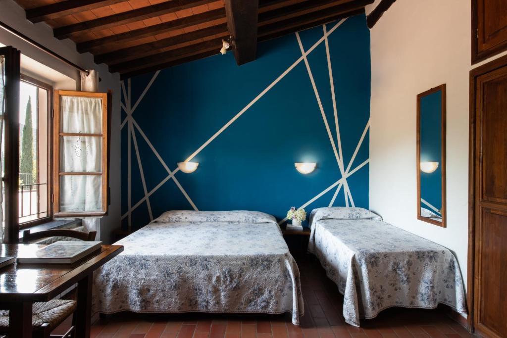 A bed or beds in a room at Villa Rinascimento Depandance