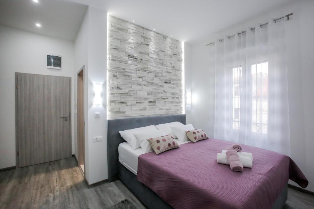 Postel nebo postele na pokoji v ubytování D&D Suites in Split Centre