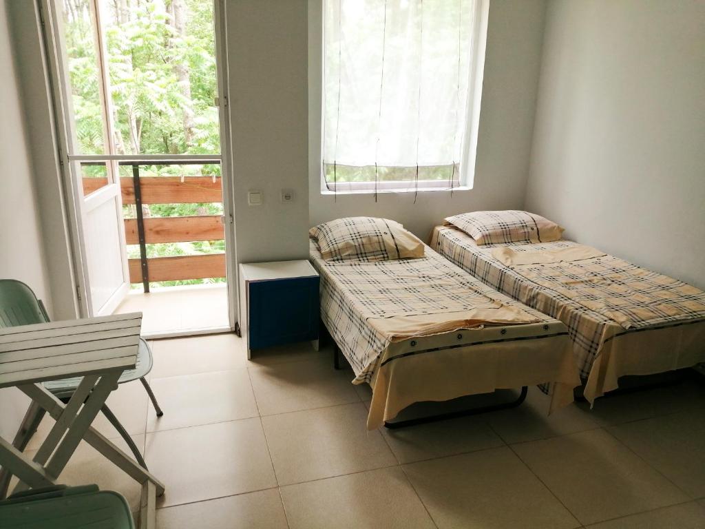 Postel nebo postele na pokoji v ubytování Villa Vachnadze