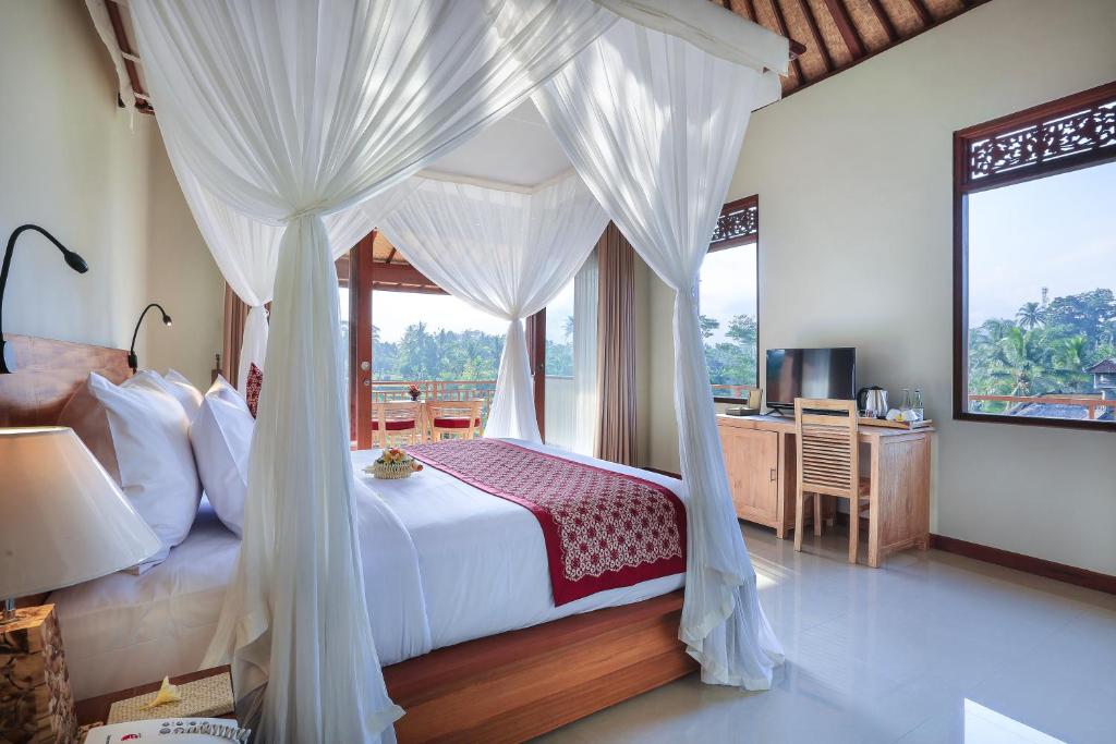 Postel nebo postele na pokoji v ubytování Nata Ubud