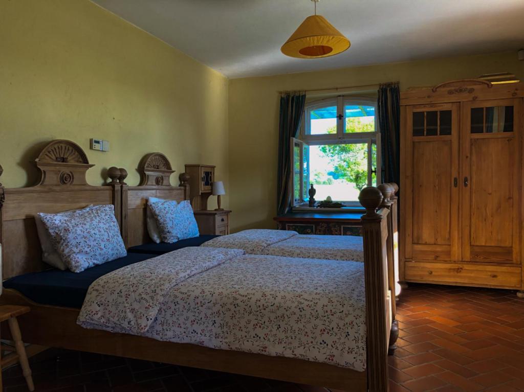 Postel nebo postele na pokoji v ubytování Dom w Puszczy