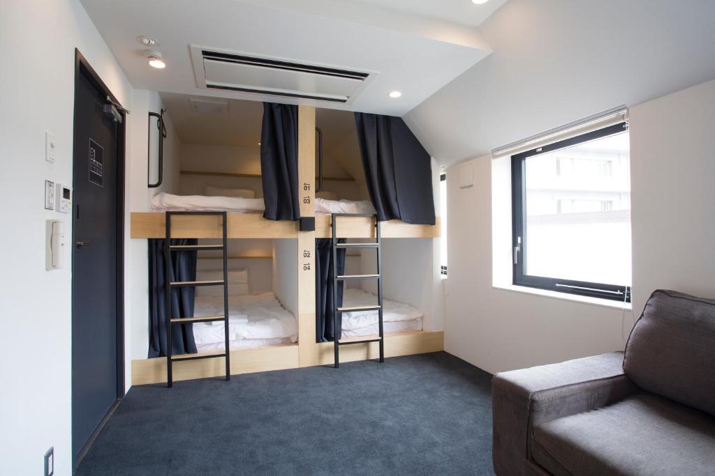 Postel nebo postele na pokoji v ubytování Piece Hostel Kyoto