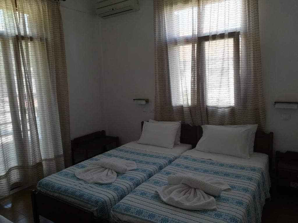 Letto o letti in una camera di Pythaïs Hotel