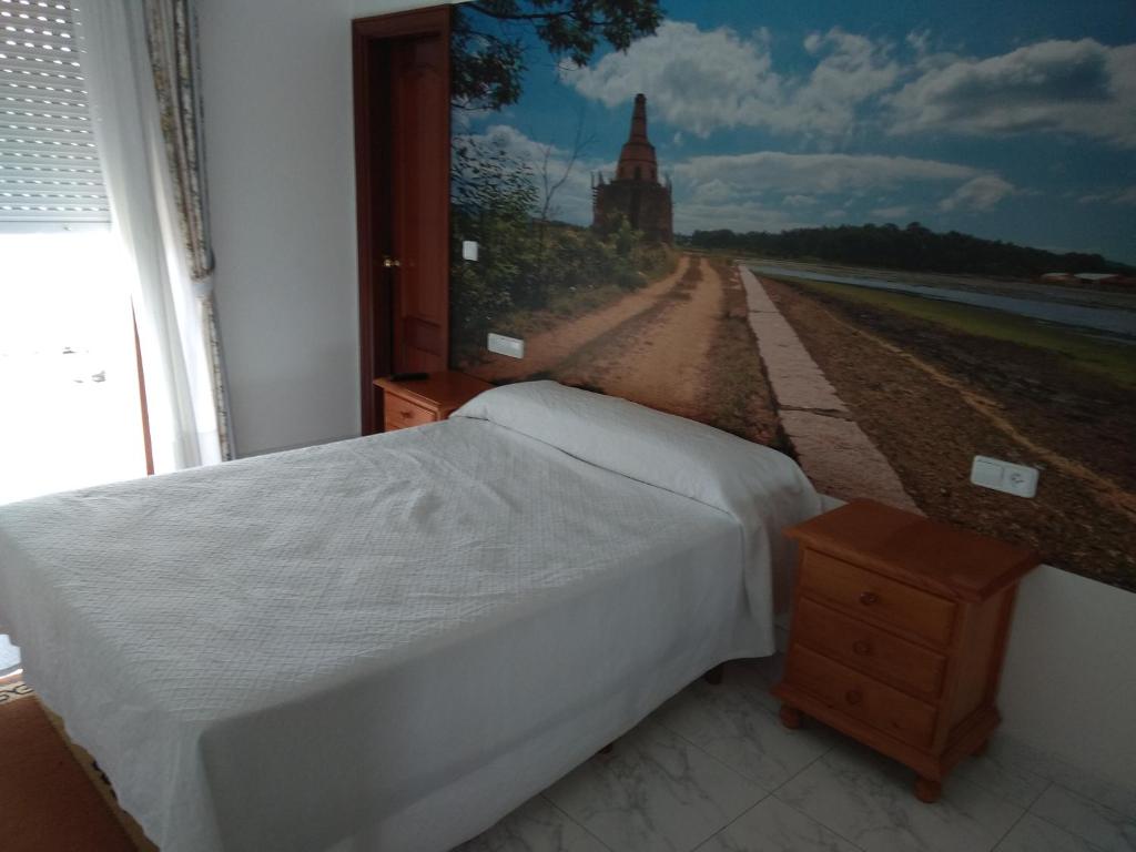 A bed or beds in a room at Casa Rodiño