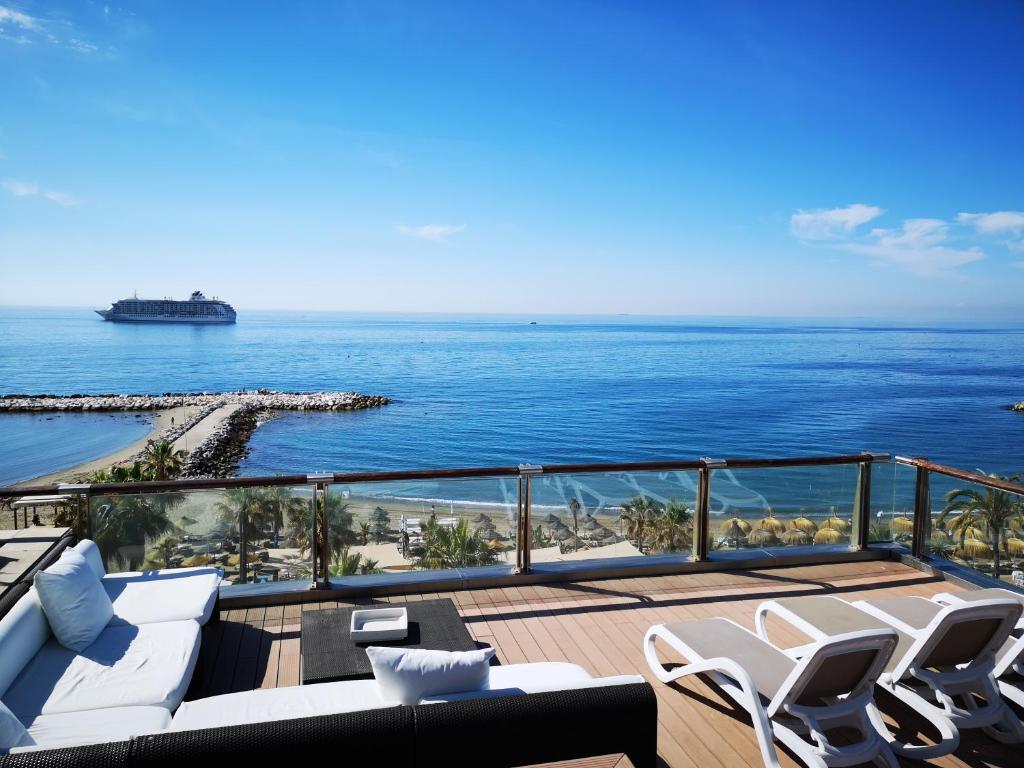 a balcony with a view of the ocean at Gran Hotel Guadalpín Banus in Marbella
